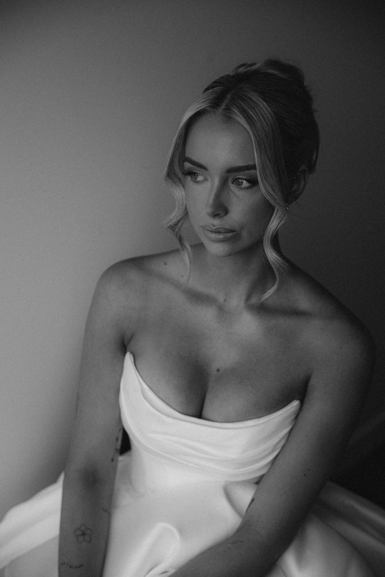 Dramatic black and white portraits in white formal attire.