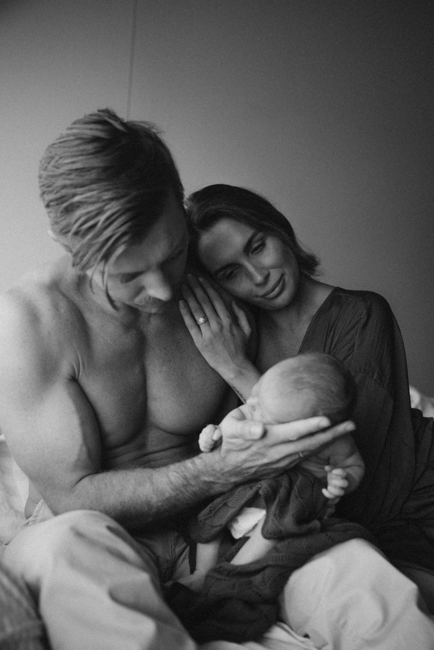 Intimate black and white portrait of two people sharing quiet moments together.