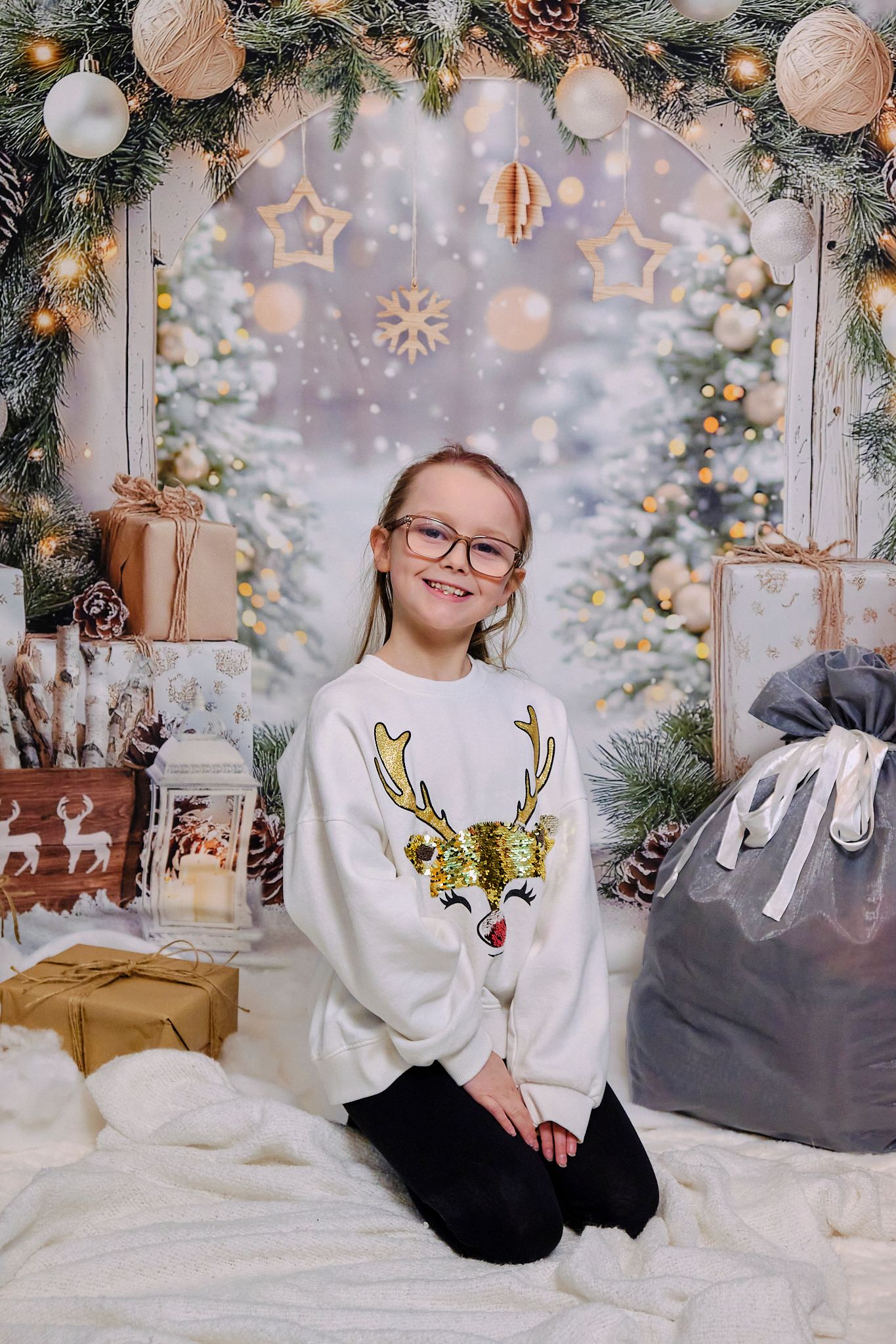 Child smiling, Christmas themed background.