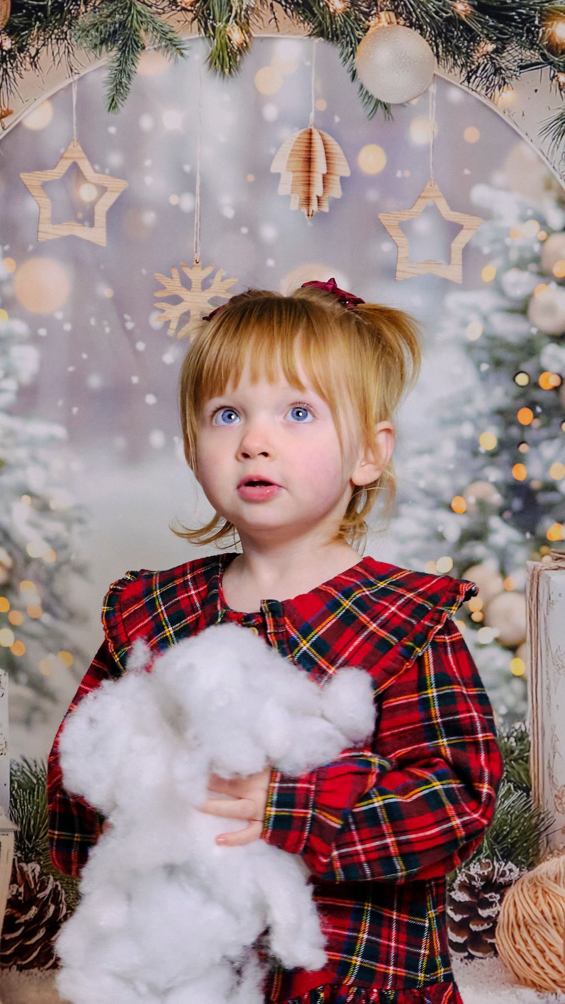 Child smiling, Christmas themed background.