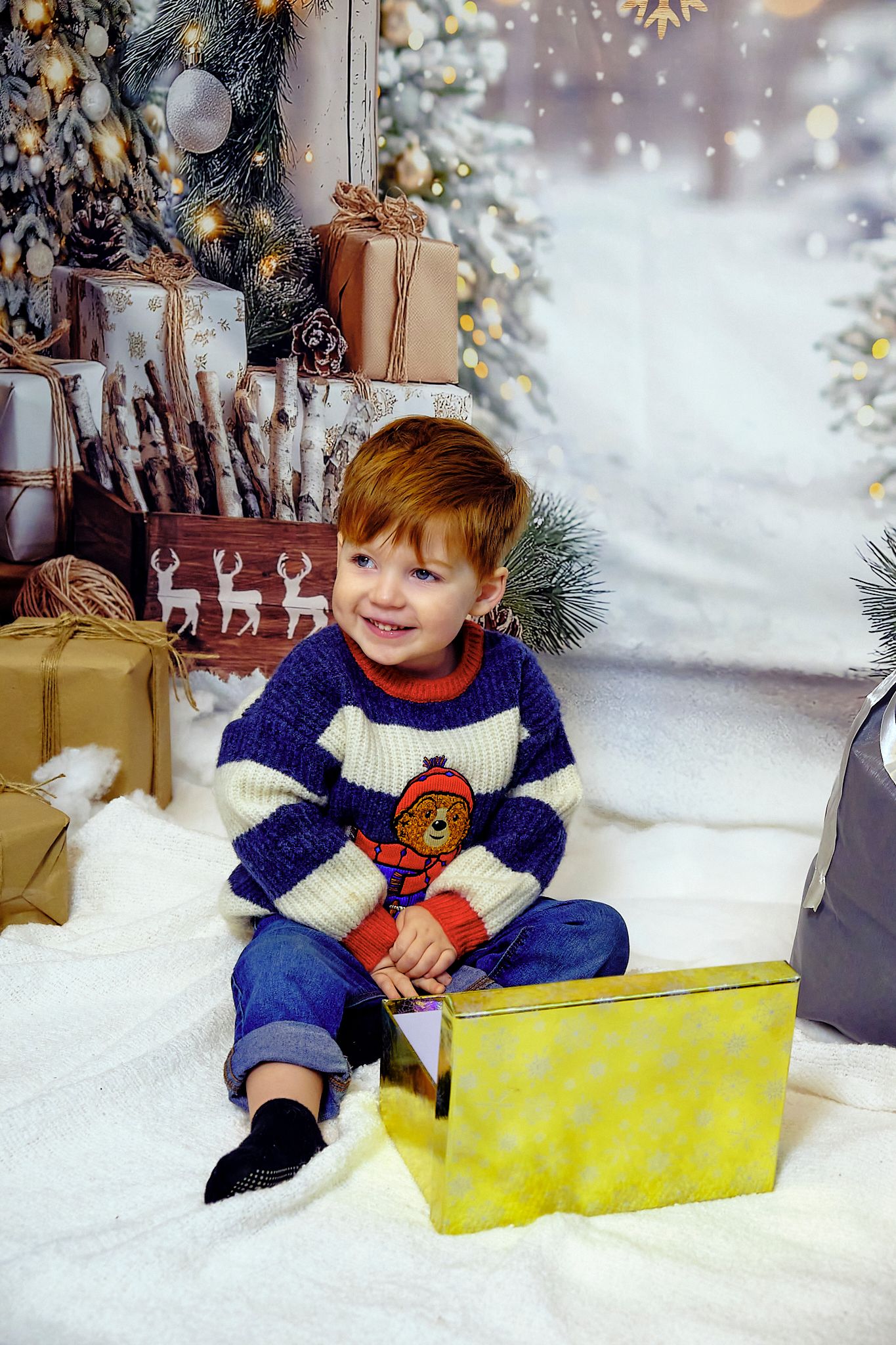 Child smiling, Christmas themed background.