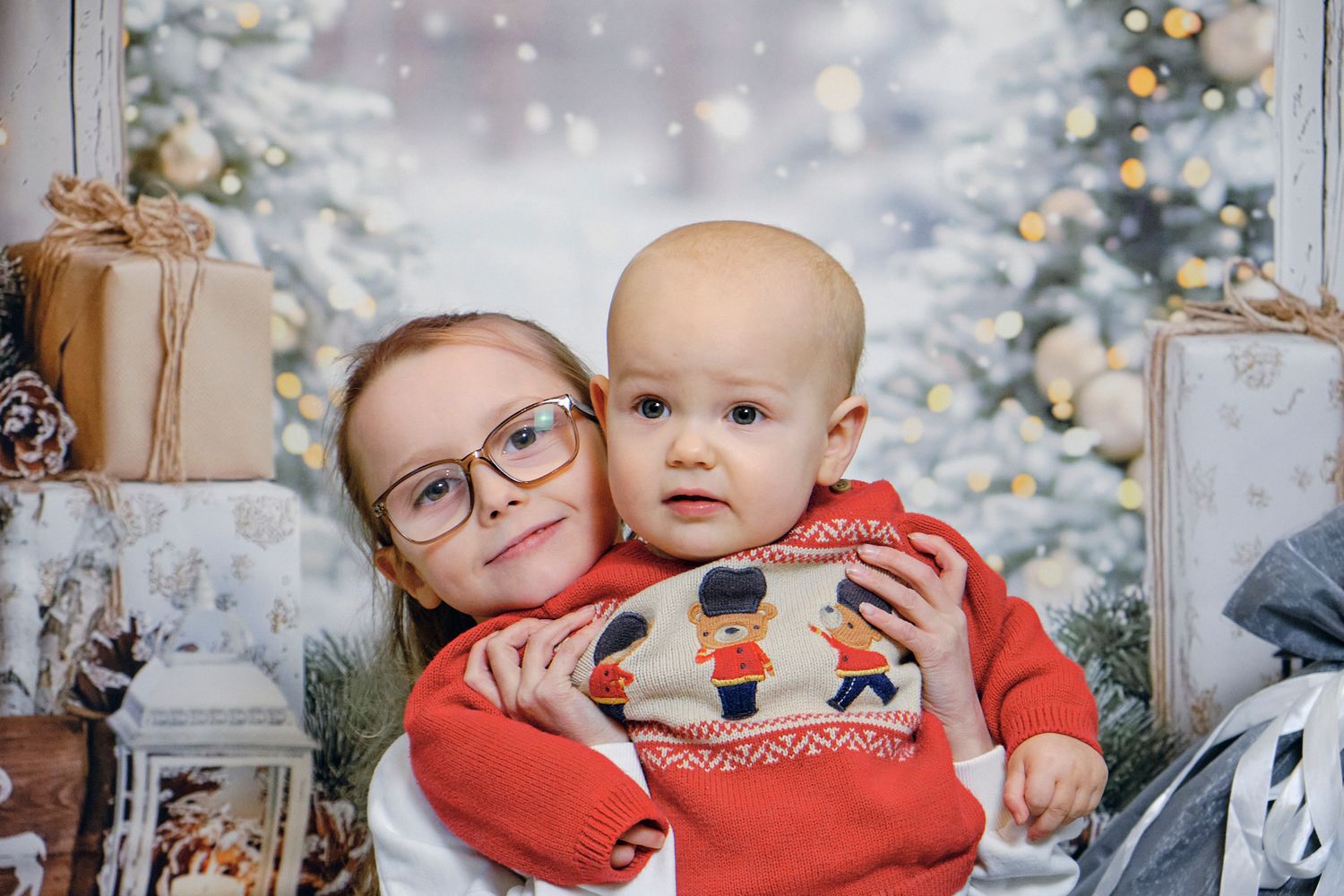 Sibling Christmas photos. siblings together with Christmas theme background.