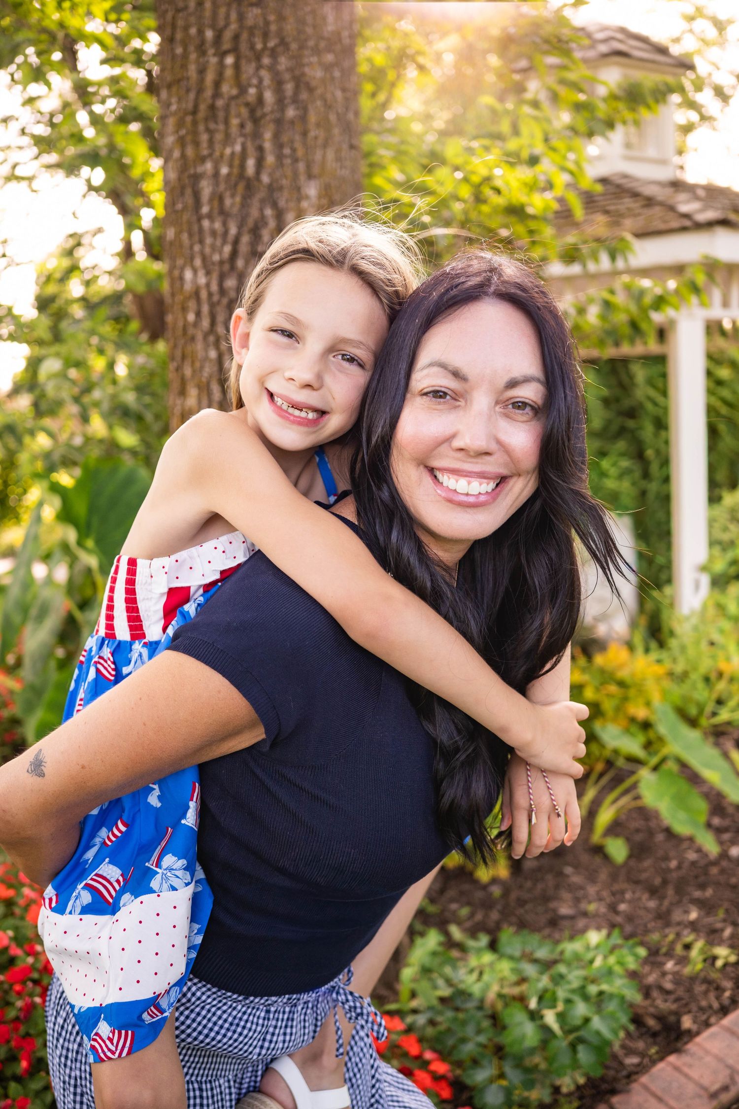 mother in daughter in motherhood photography session in downtown Bentonville by the best motherhood photographer in Northwest Arkansas.