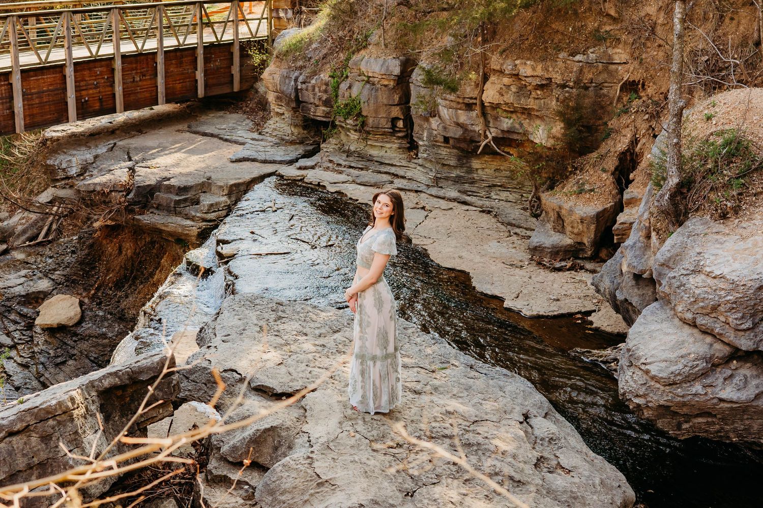 beautiful senior photography session at waterfall in bella vista arkansas by the best senior photographer in northwest arkansas