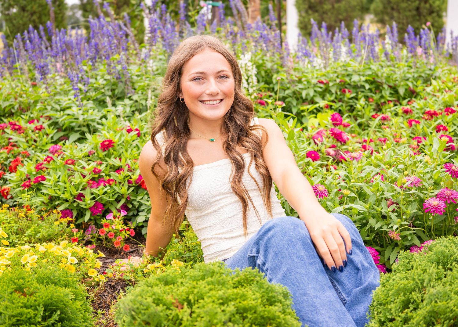 gorgeous senior session at a wildflower garden in bentonville arkansas by the best senior photographer in Northwest Arkansas