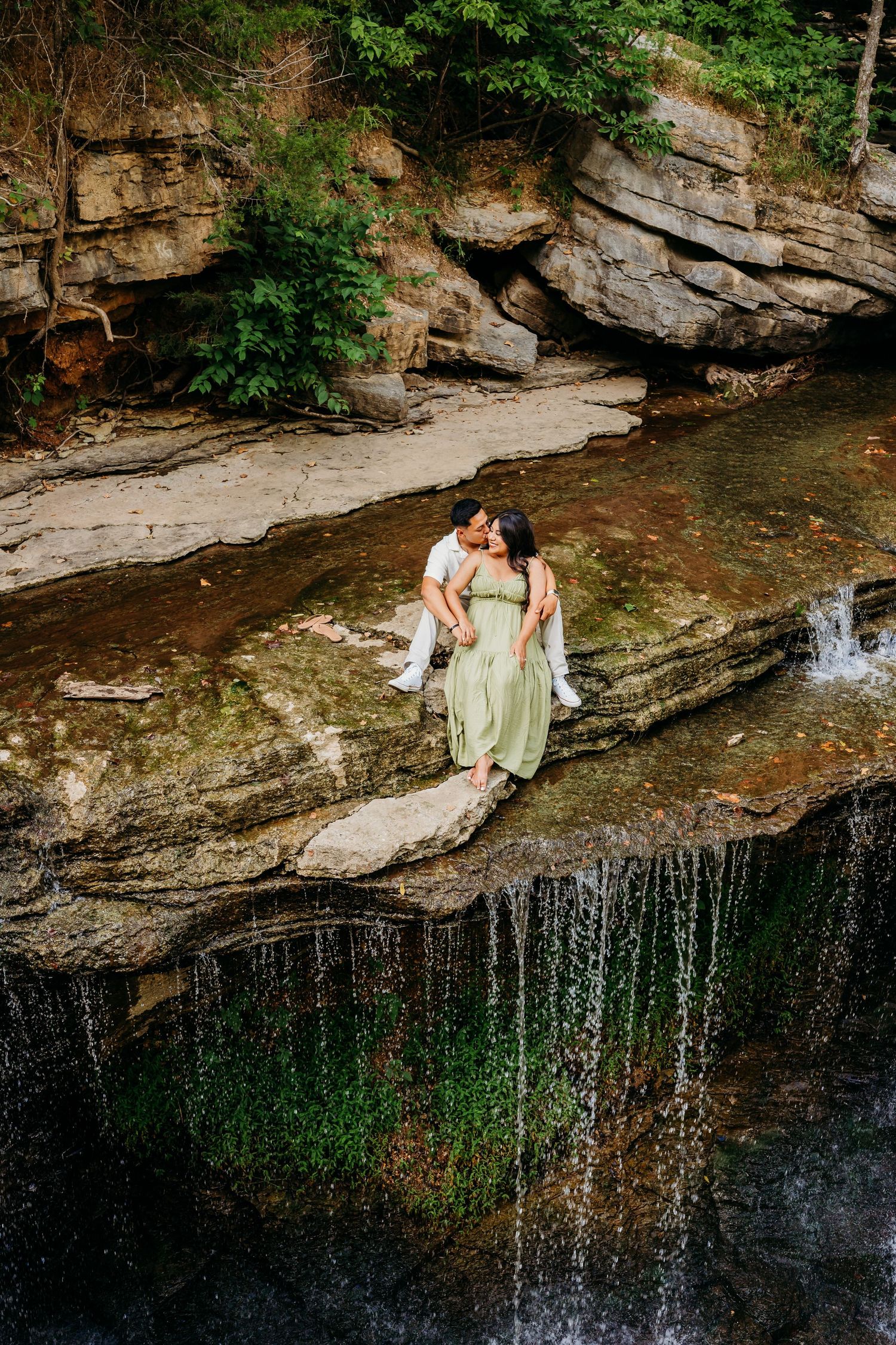 stunning engagement Session photoshoot in bella Vista at Pinion Falls waterfall by the best photographer in Northwest Arkansas.