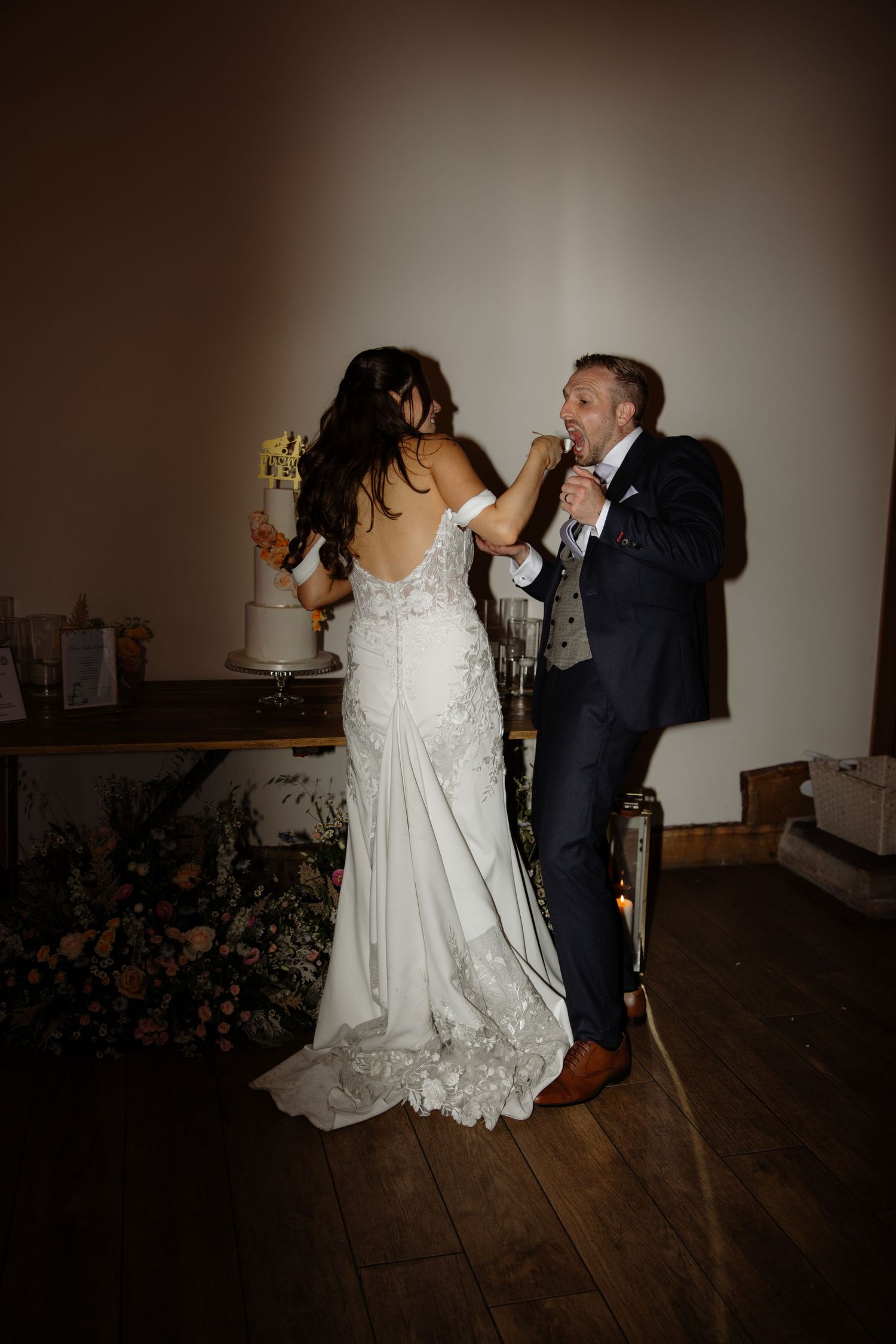 A romantic wedding dance sequence showing a couple performing a dramatic dip move in formal attire.