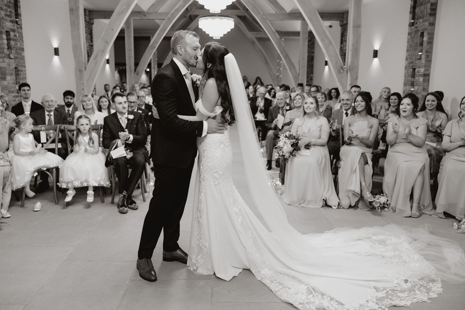 A sequence of black and white wedding dance photos showing couples dancing in an elegant ballroom setting.