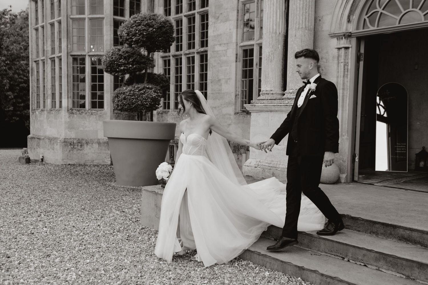 A sequence of wedding photographs showing a couple walking and posing outdoors at an elegant venue with white columns.