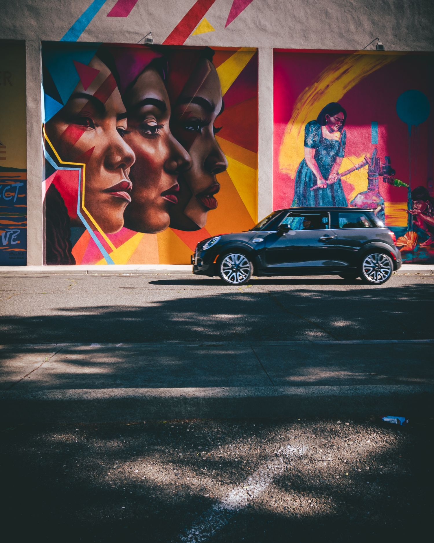 Street art background as a car zooms by in Yuba City, CA
