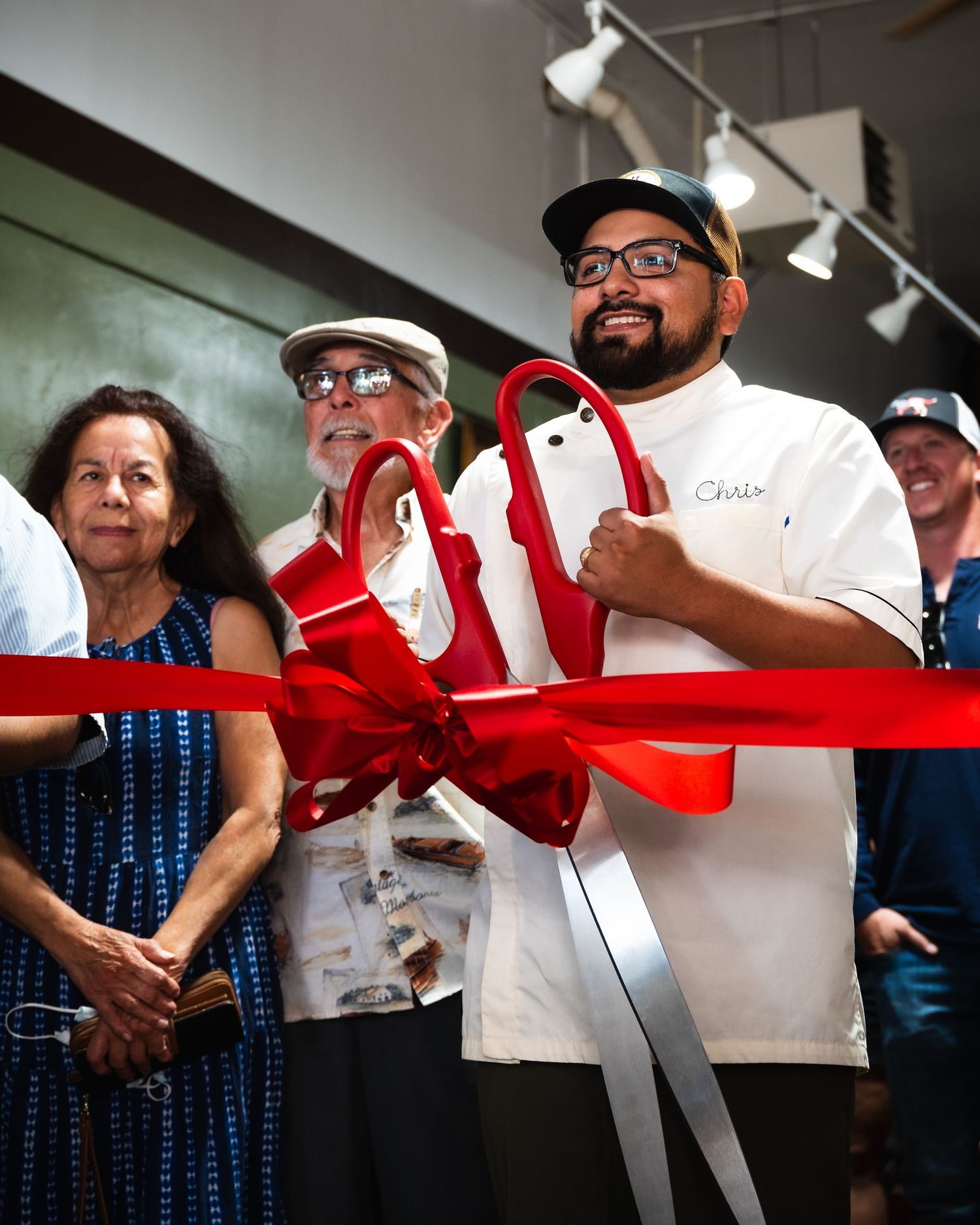 Ribbon cutting for the grand opening of a barbershop