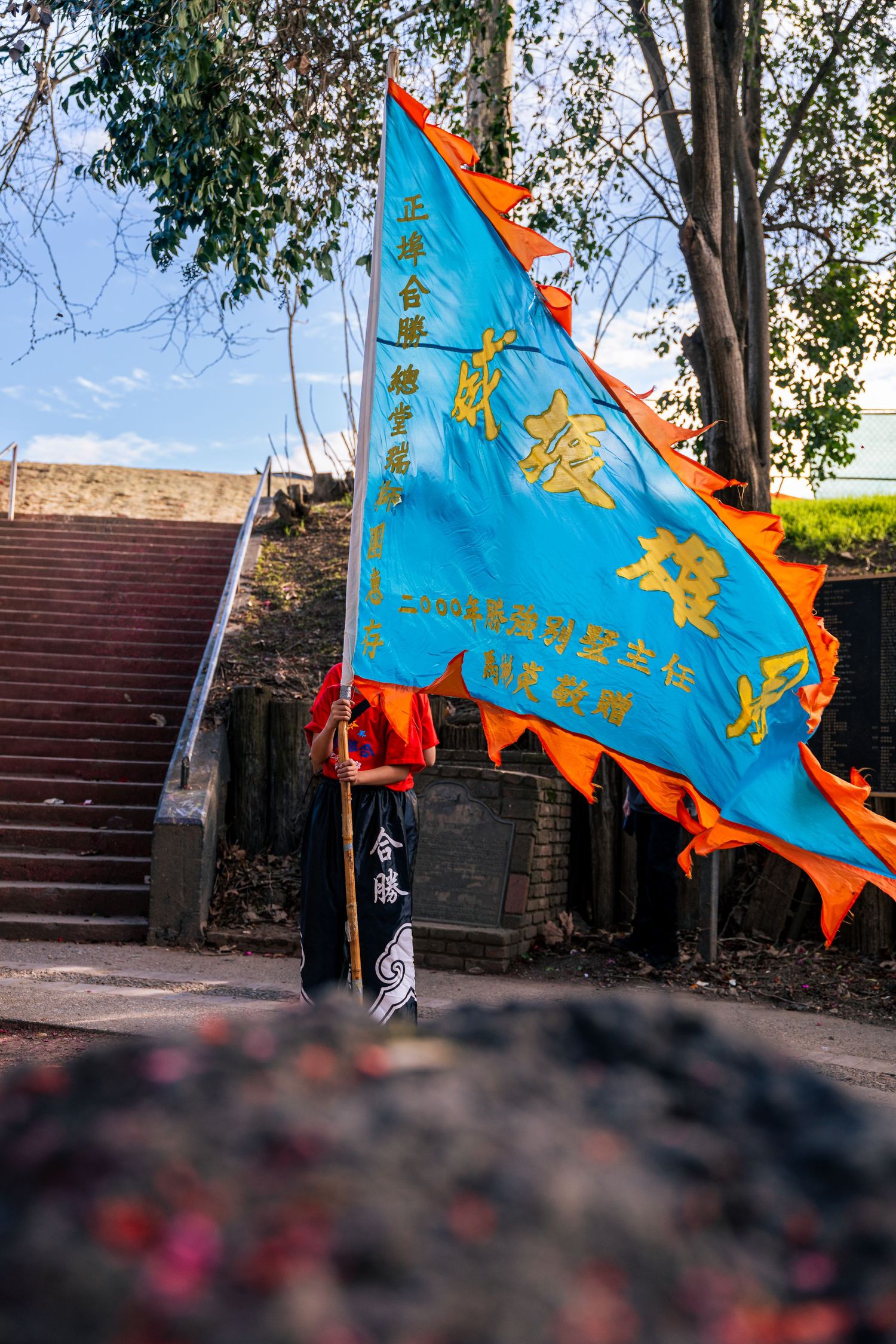 Flag bearer during the Bok Kai parade in Marysville, CA