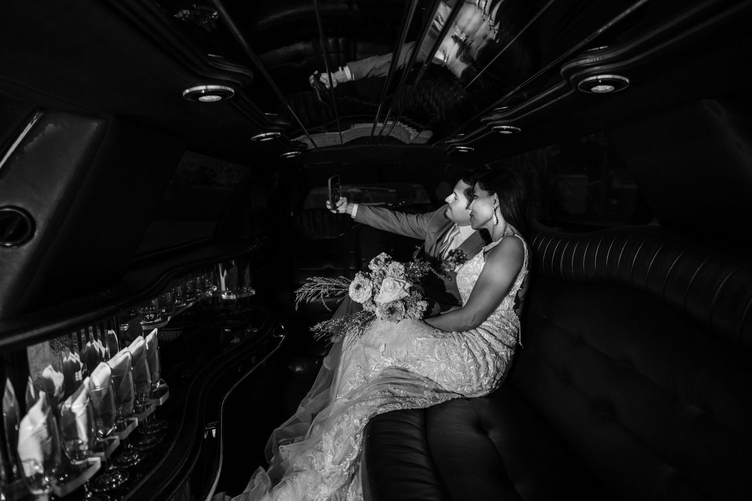 A series of black and white wedding photographs showing couples dancing and celebrating at a reception.
