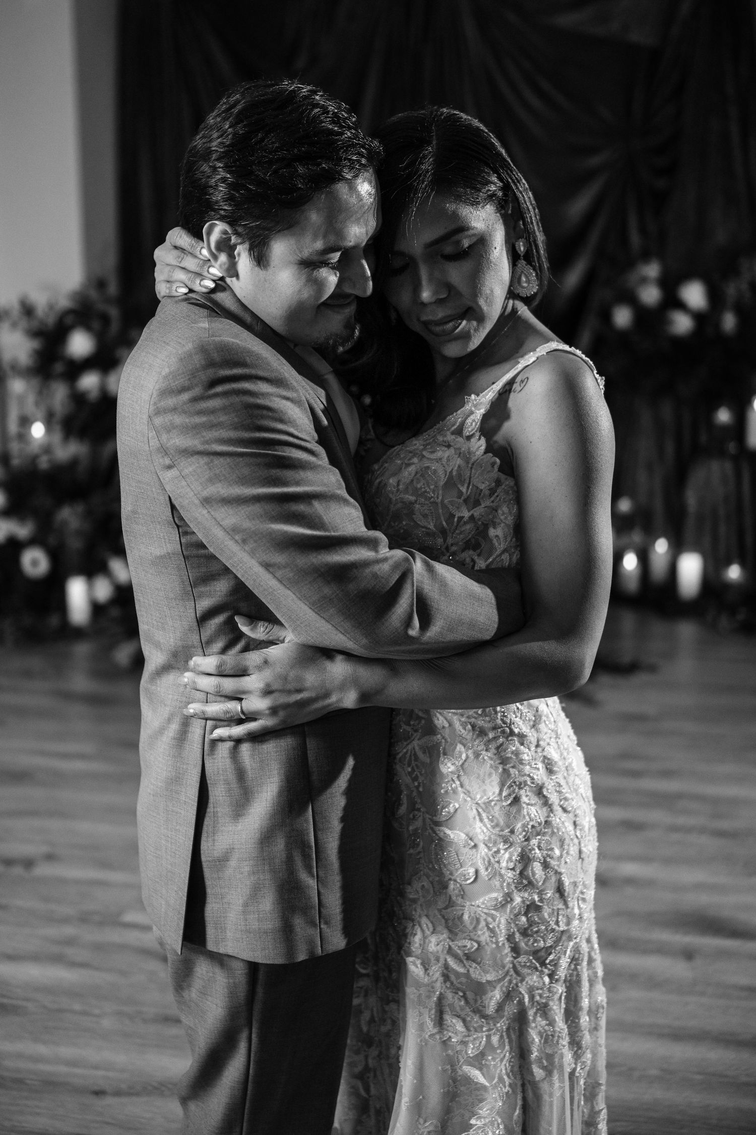 A romantic black and white photo sequence shows a couple sharing their first dance at a wedding reception.