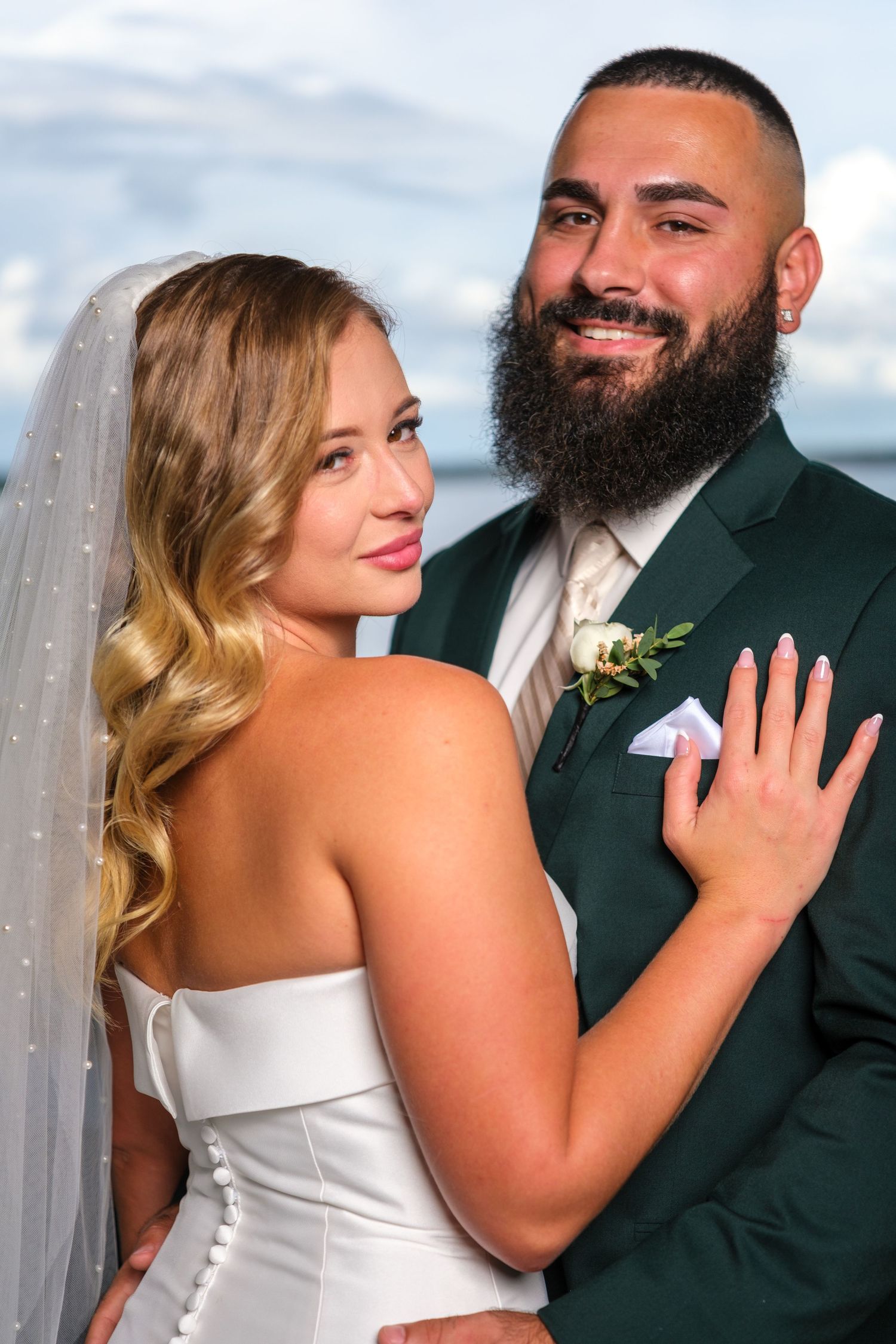A bride and groom share intimate moments in a series of romantic wedding photos outdoors.