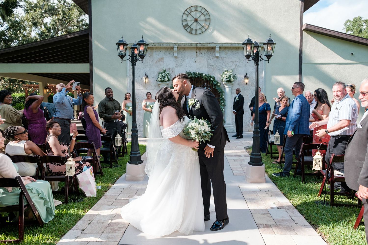 A sequence of outdoor wedding ceremony moments showing the couple exchanging vows and celebrating with guests.