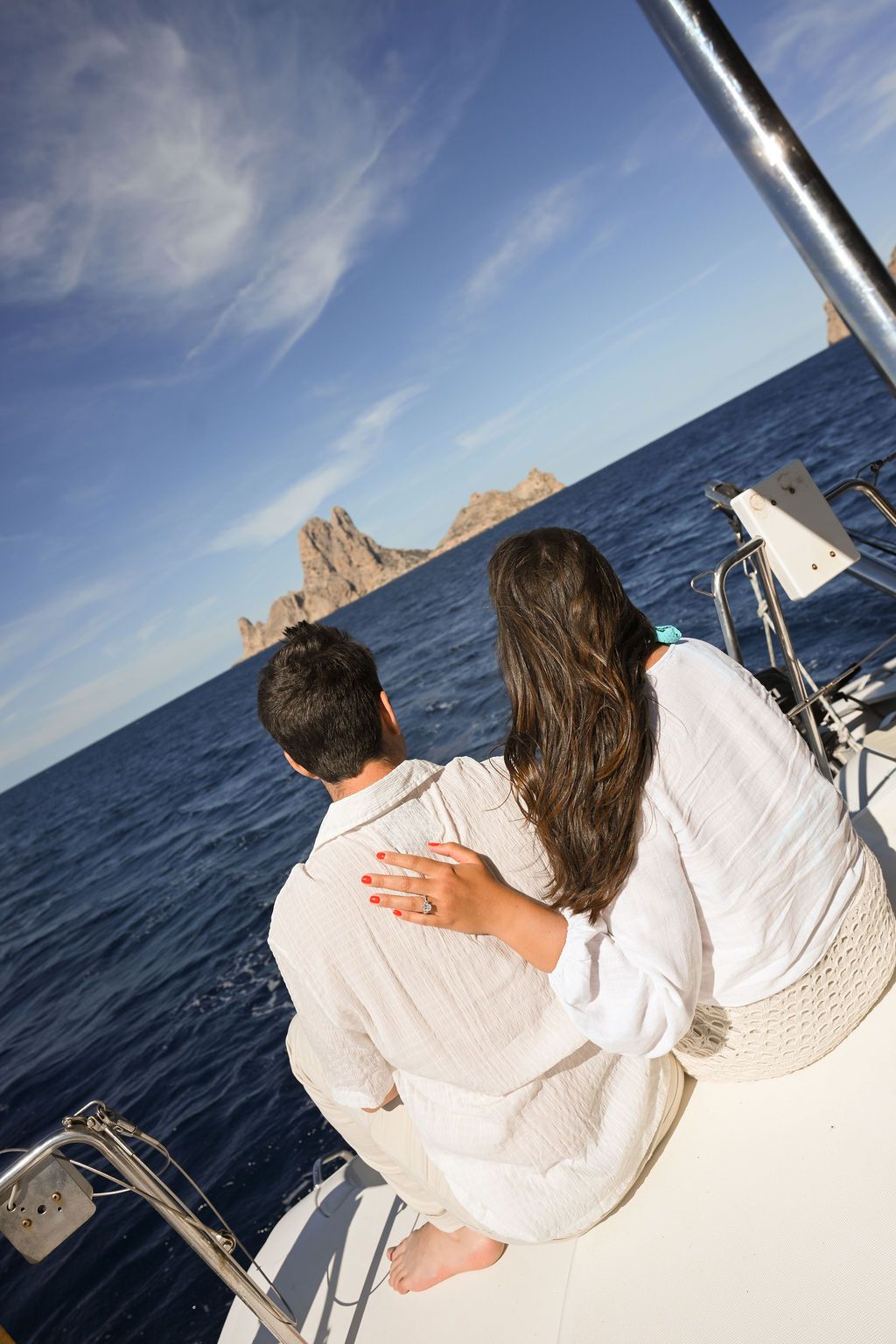 Surprise proposal captured in a romantic setting.