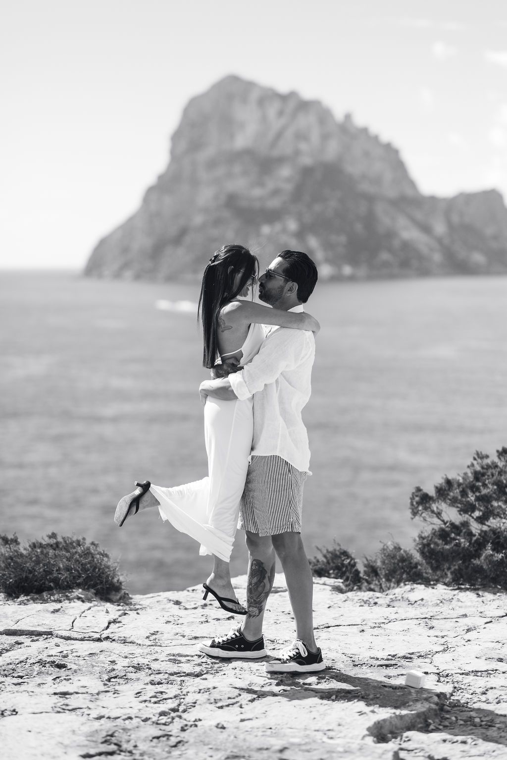 Emotional reaction during a surprise proposal in Ibiza by the sea.