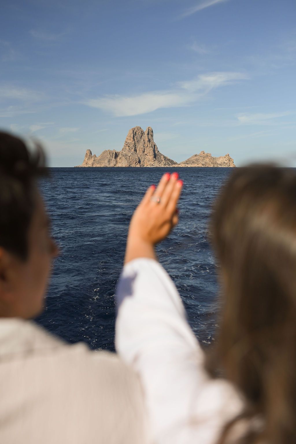 Celebration after a surprise proposal on a catamaran in Ibiza.