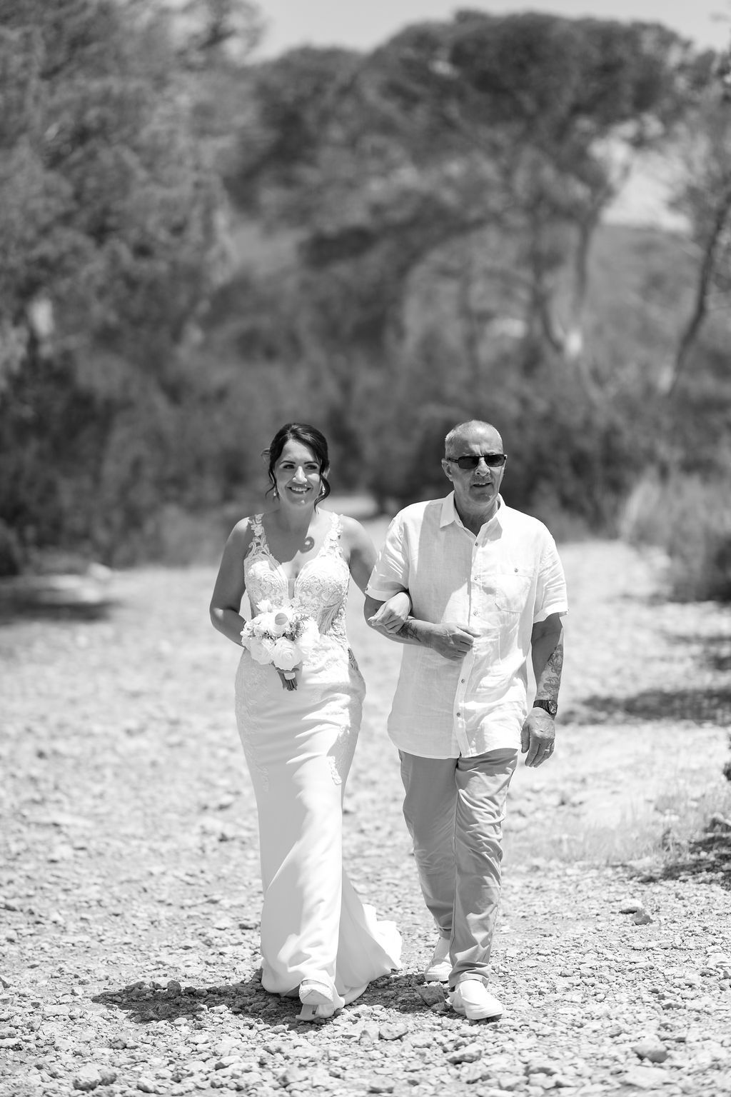 Bride and father during an elopement at Es Vedrà in Ibiza.