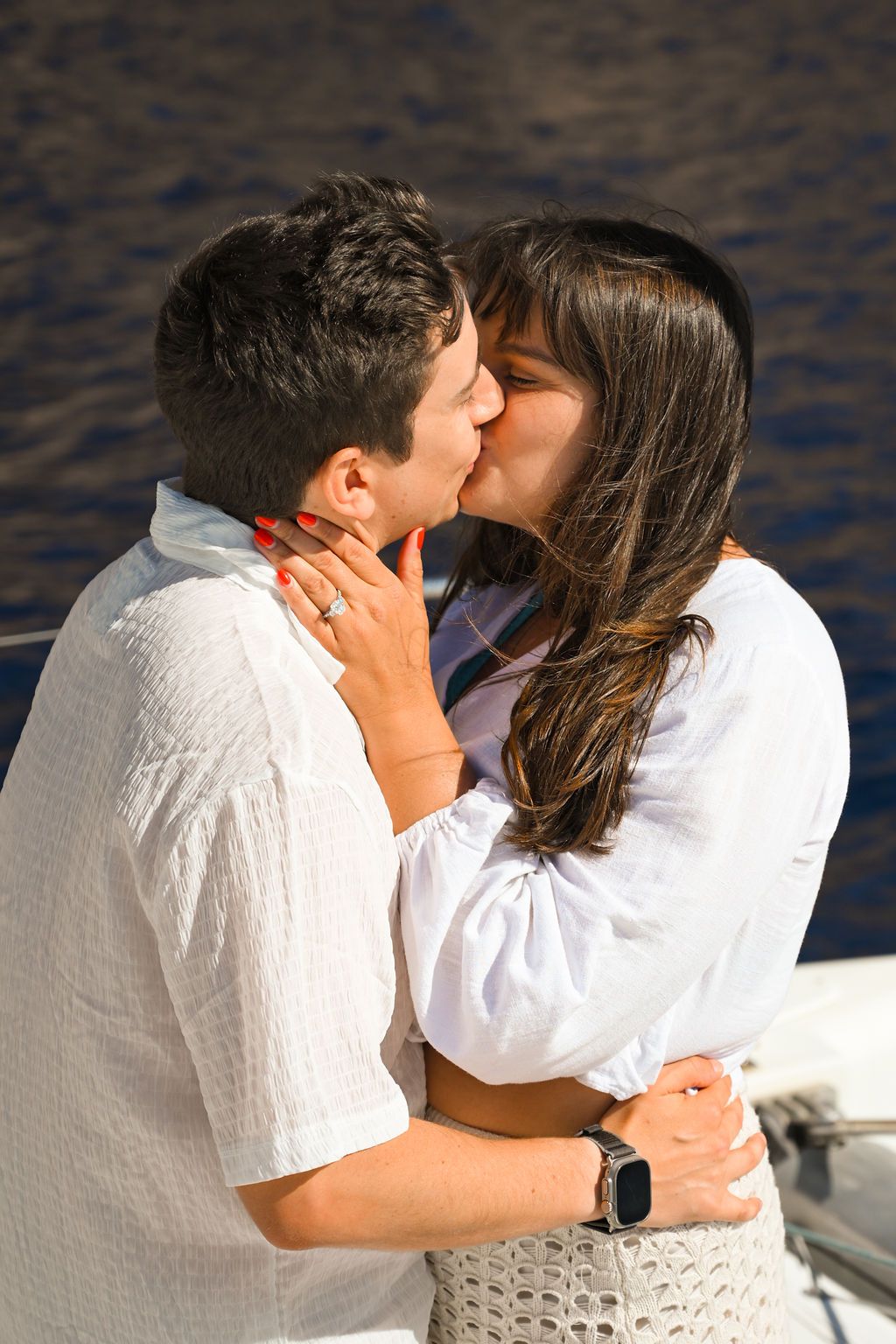 Emotional reaction during a surprise proposal on a catamaran in Ibiza