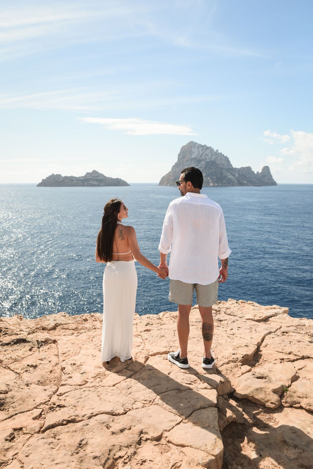 A beautiful surprise proposal in Ibiza captured in soft morning light with stunning sea views