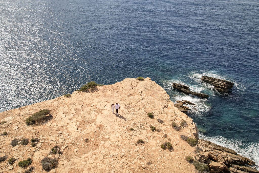 Drone view of a marriage proposal at Es Vedra, Ibiza ,overlooking the sea