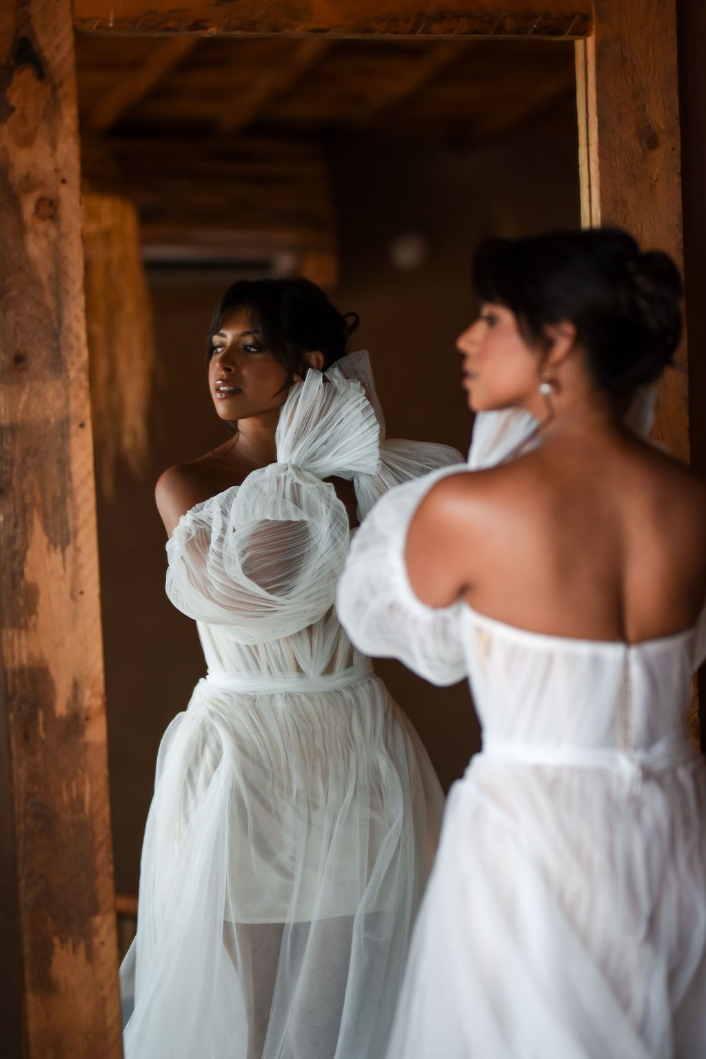 The bride is getting ready for their elopement at Alkamar Camp in the Agafay Desert.