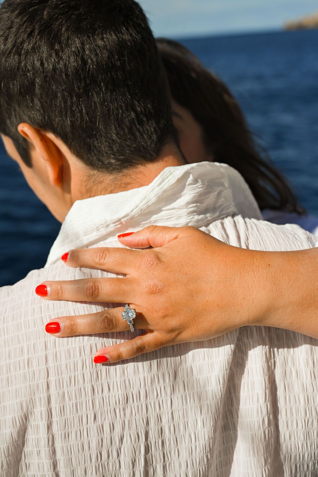 Engagement ring colse up during a proposal on a catamaran in Ibiza.