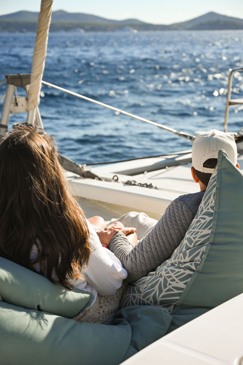 Romantic couple on a catamaran during a proposal in Ibiza.