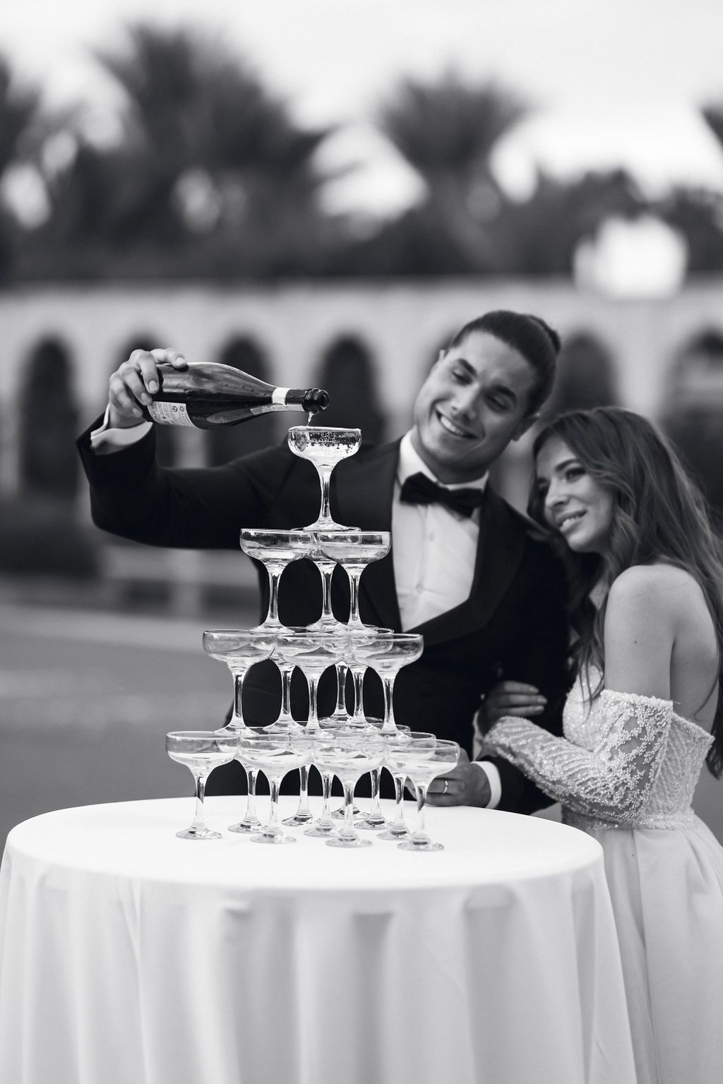 Champagne tower celebration at a wedding at Palais Namaskar in Marrakesh.
