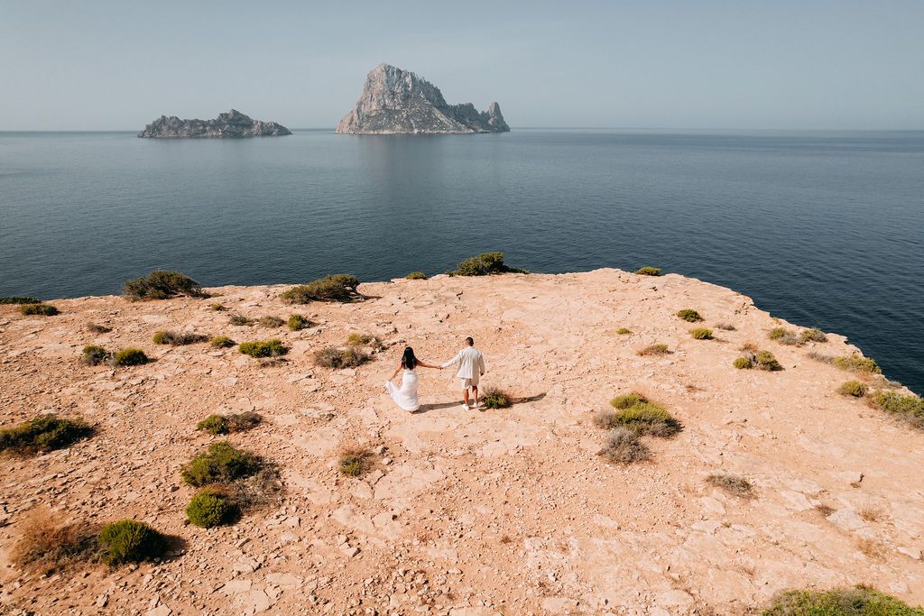 Proposal photographer in Ibiza, drone photo of a couple with Es Vedra views.