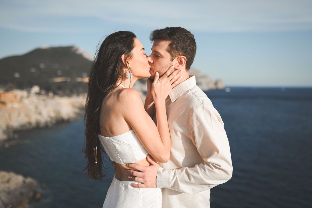 Surprise Spain proposal photographer, Engagement photo session near Es Vedrà in Ibiza with a couple.