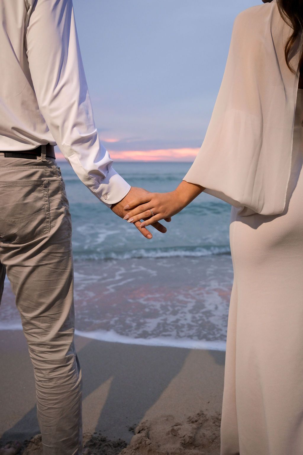 Engagement ring detail with ocean background at Cala Tarida