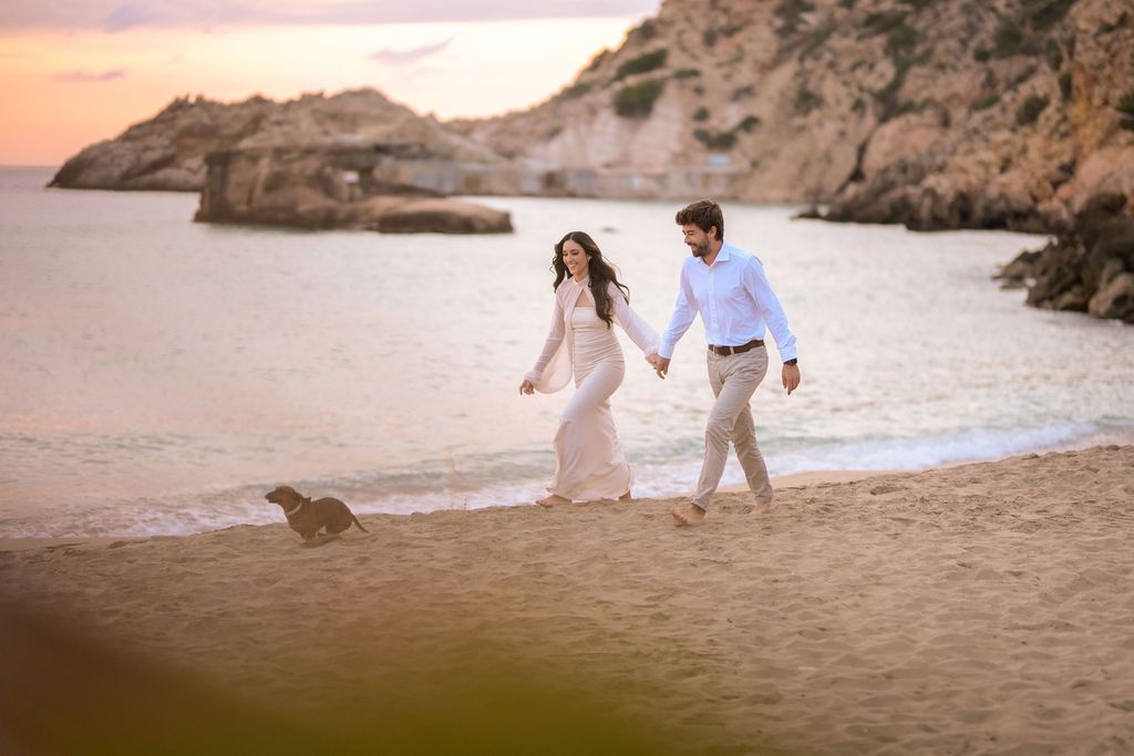 Couple walking on the beach during engagement session in Ibiza