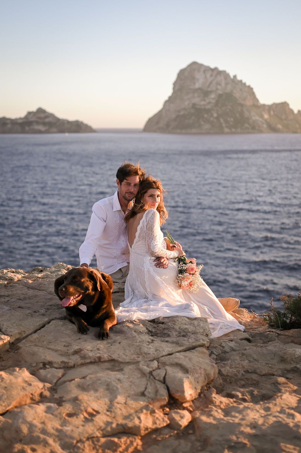 Bride and groom eloping at Es Vedra in Ibiza with their dog.