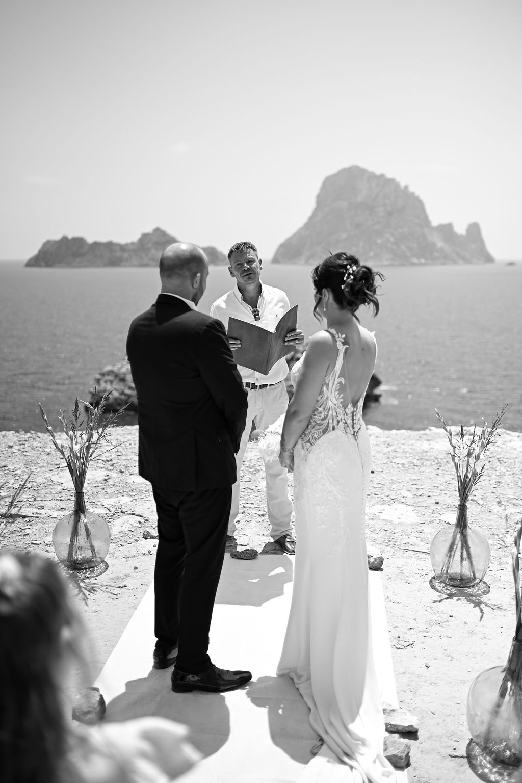 Bride and groom exchanging vows during their Es Vedra elopement in Ibiza.