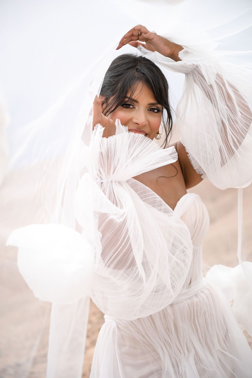 Romantic elopement portraits at Alkamar Camp, Morocco.