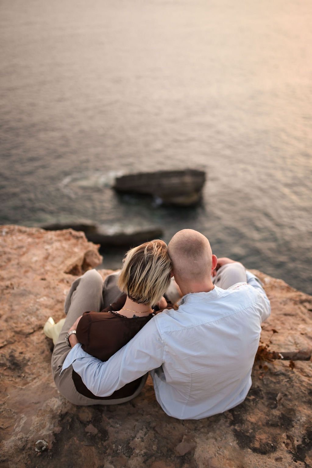 Engaged couple photographed in Ibiza during a romantic engagement session.