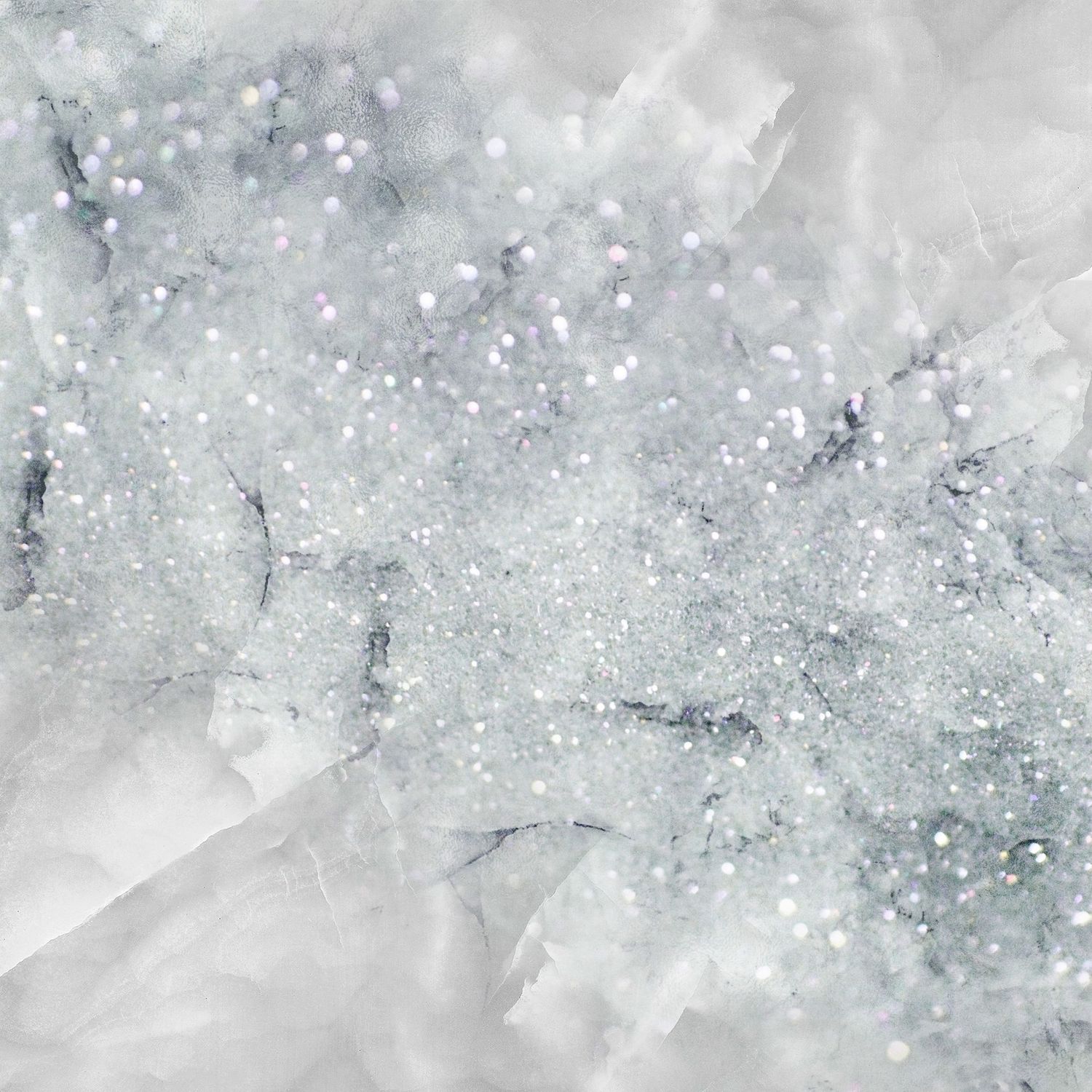Sparkling silver glitter scattered on crumpled white tissue paper with shimmering bokeh light effects.