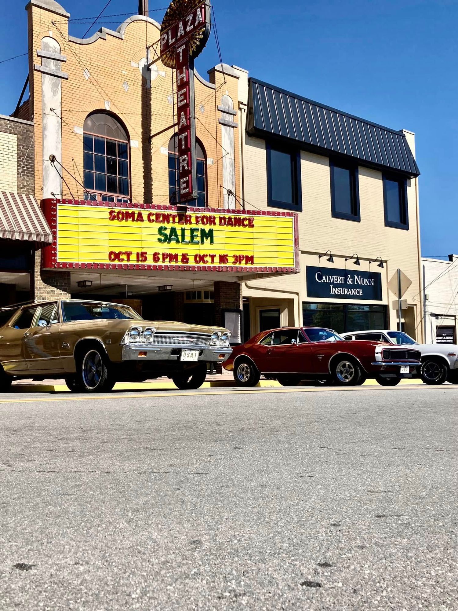 Plaza Theatre marquee advertising Soma Center for Dance Salem show on Oct 15 and 16, with classic cars parked outside.