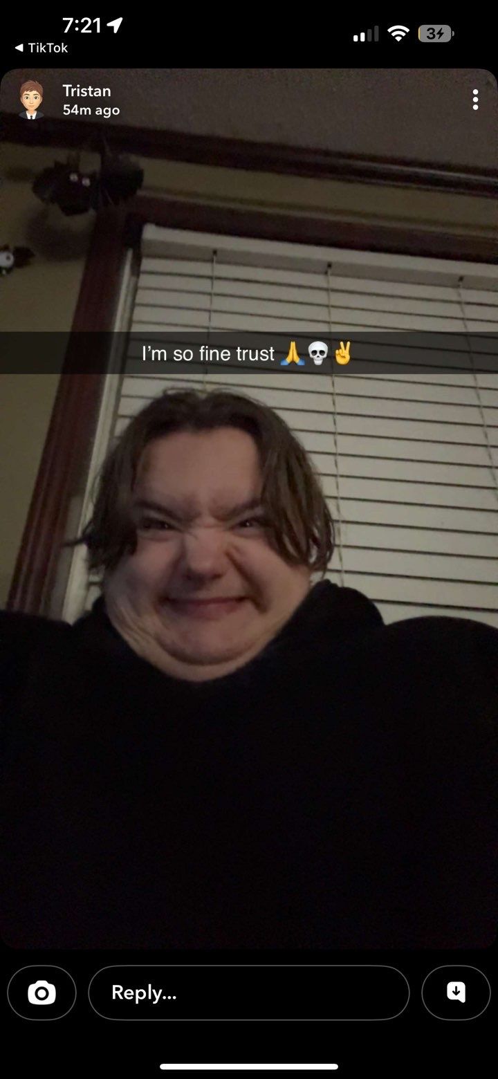 Person making a funny face on Snapchat with text overlay saying I'm so fine trust, with emojis.