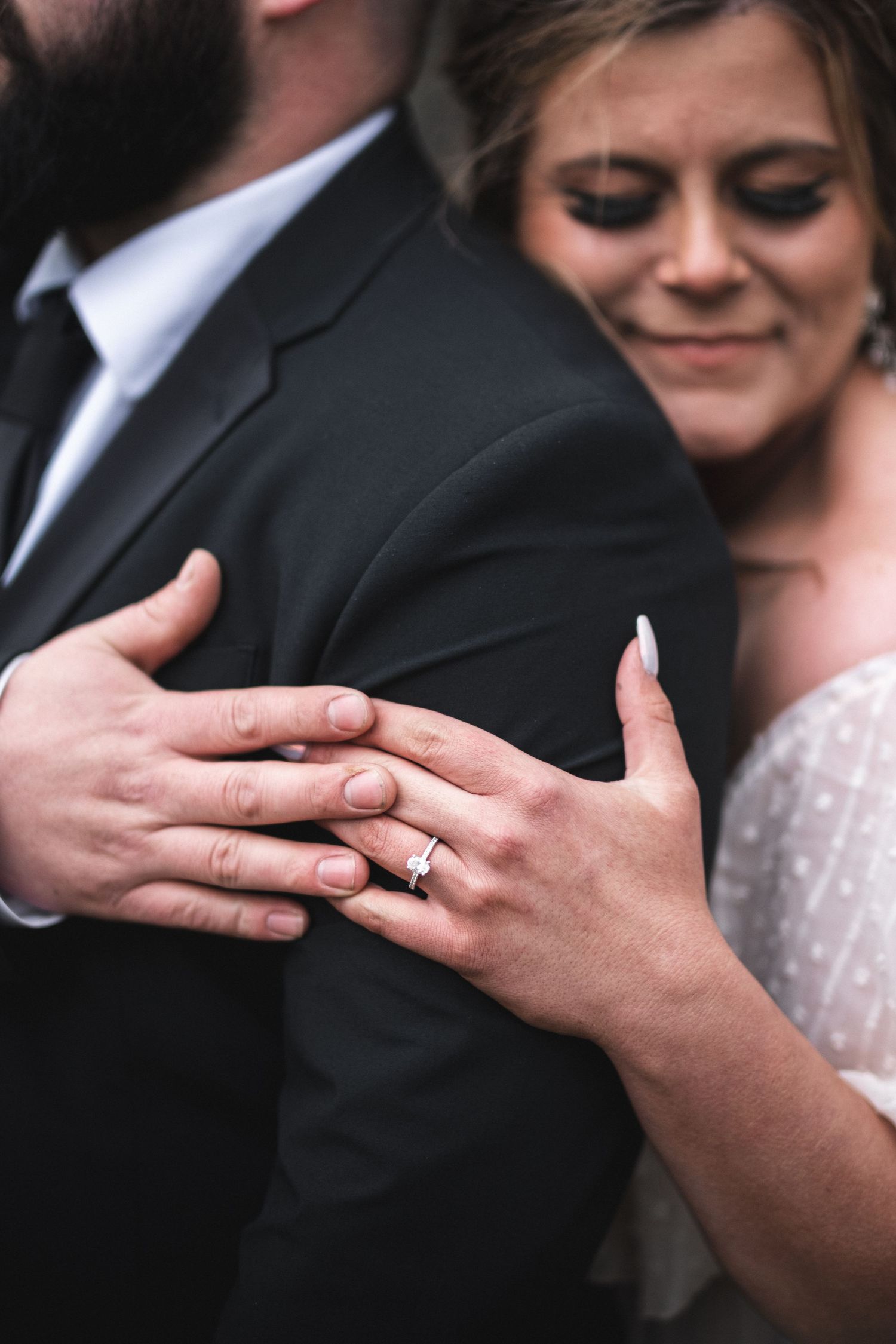 The image captures a tender engagement moment, showcasing the artistry of McClure’s Photography.