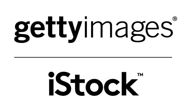 Outdoors at nighttime showing sky with moon and trees in silhouette against starry background.