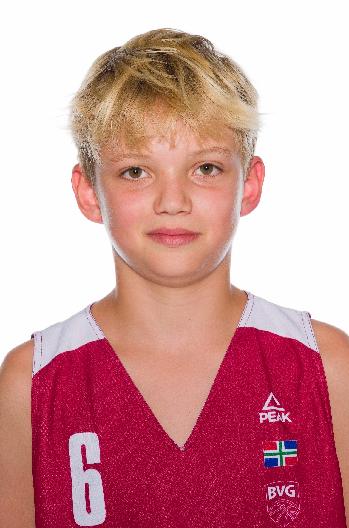 Young basketball player with blond hair wearing a red number 6 Peak jersey with a BVG logo and flag patch against a white background.