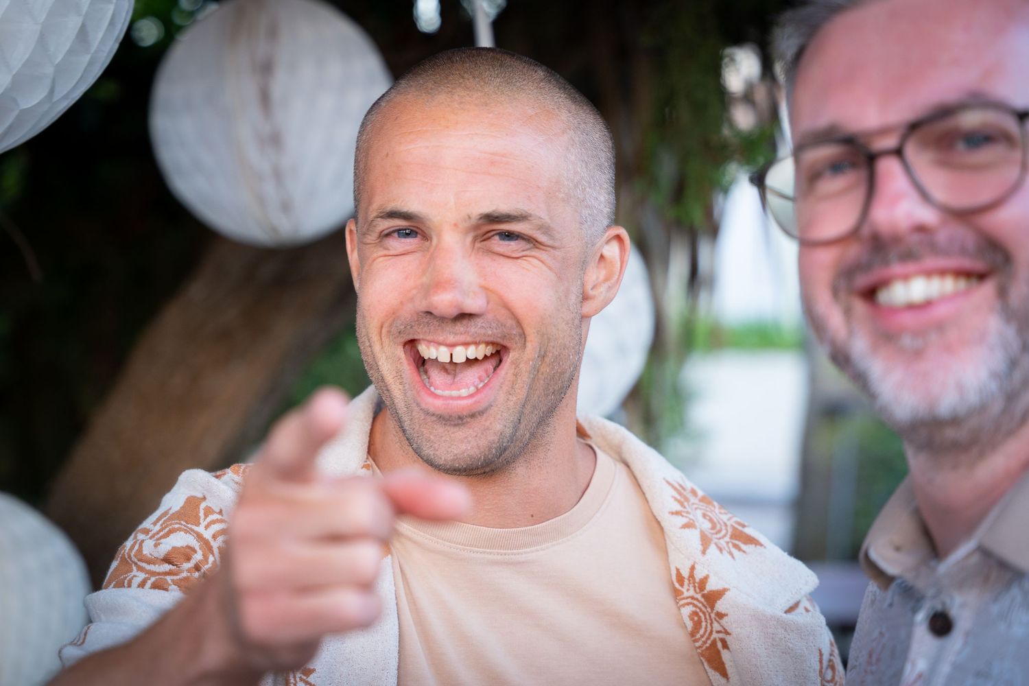 A series of candid portrait photos showing people smiling and laughing during a casual gathering outdoors.