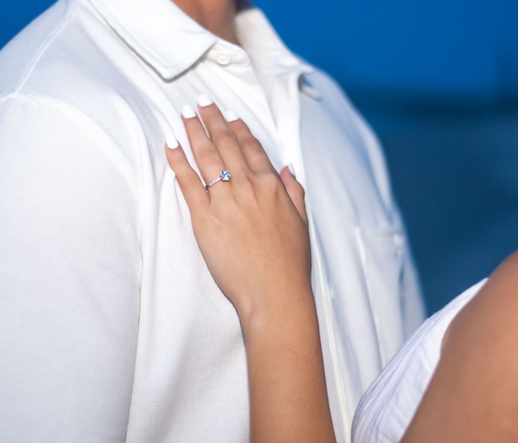 Detail shots of white clothing and jewelry during a beach photoshoot.