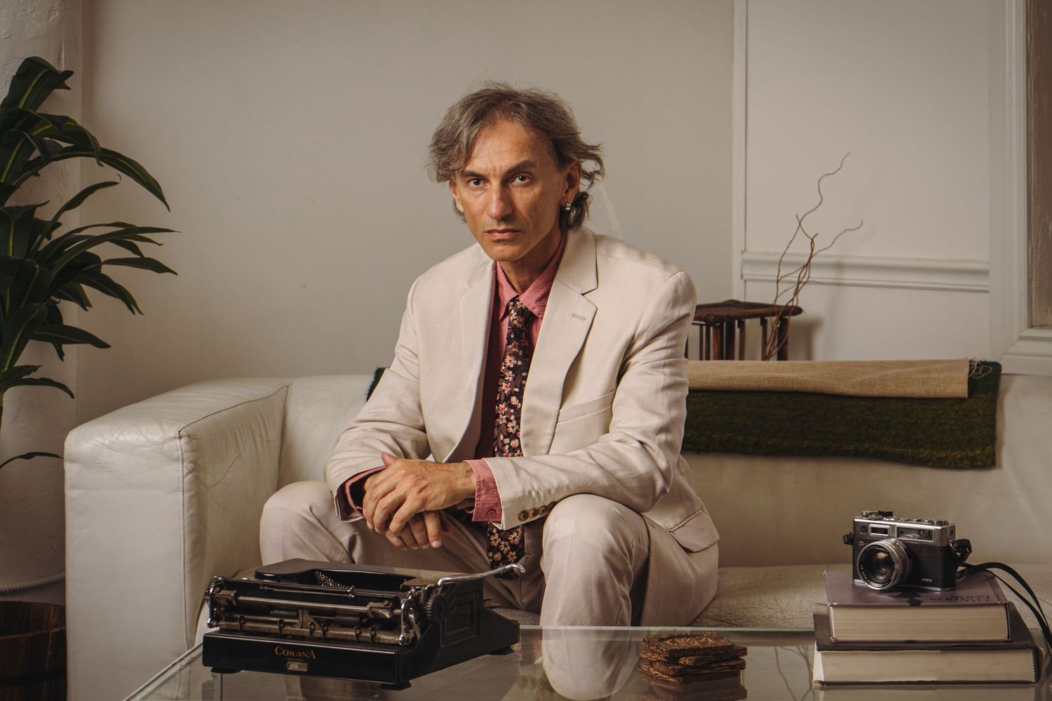 man sit in front of typing machine