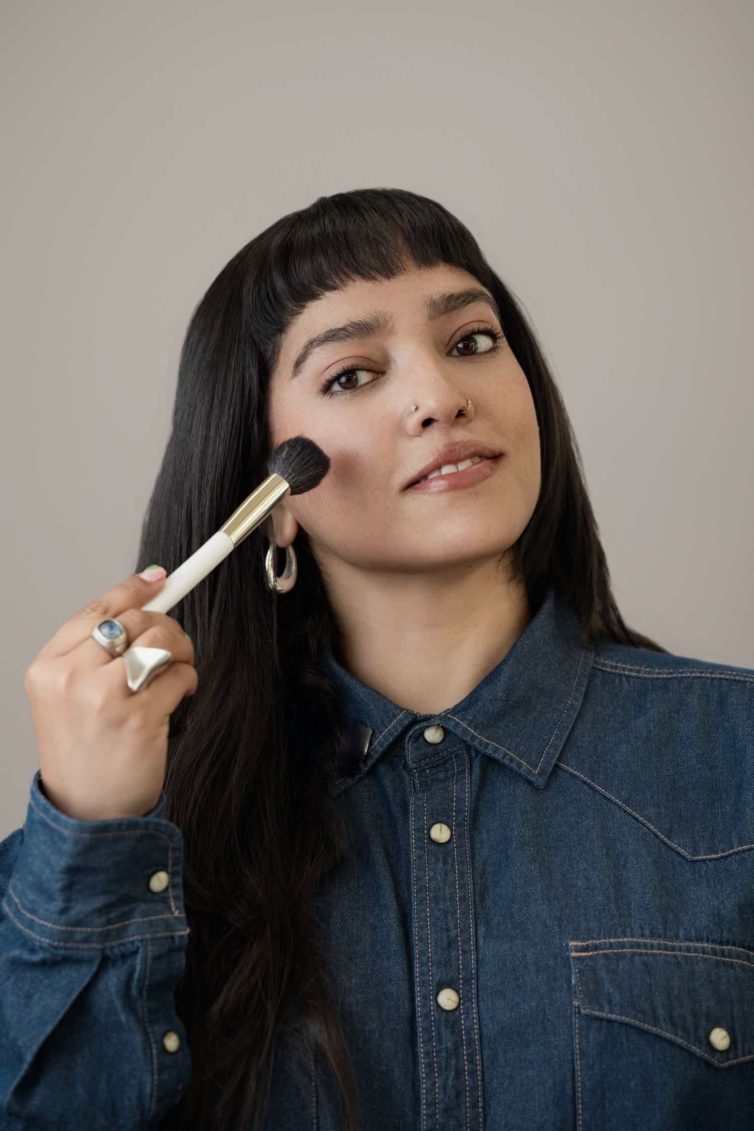 Woman with makeup brush