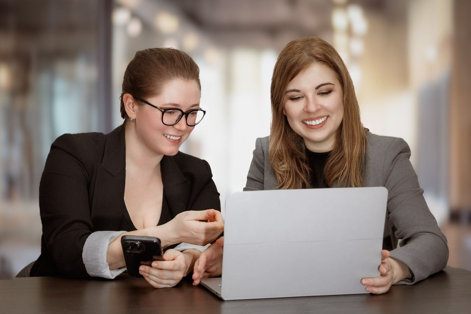 two women in from of laptop